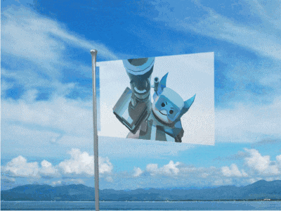 a flag with a picture of a robot on it against a blue sky