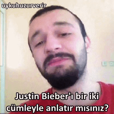a man with a beard says justin bieber 's bir iki cümleyle anlatir misinz