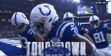 the indianapolis colts are celebrating a touchdown against the washington redskins