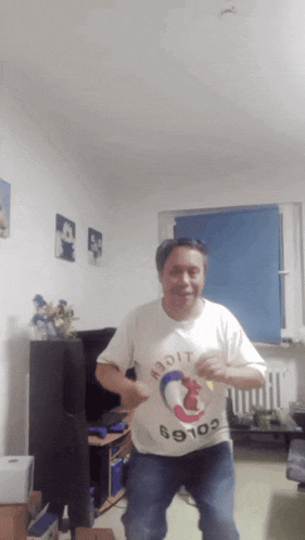 a man wearing a shirt that says 69109 is dancing in a room