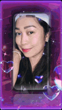 a woman 's face is displayed on a purple background