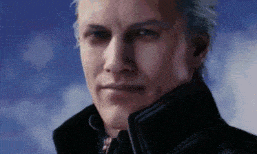 a close up of a man 's face wearing a black jacket .