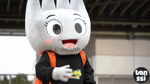 a mascot is wearing a shirt that says tan ssi on it