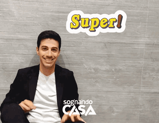 a man is smiling in front of a sticker that says super on it