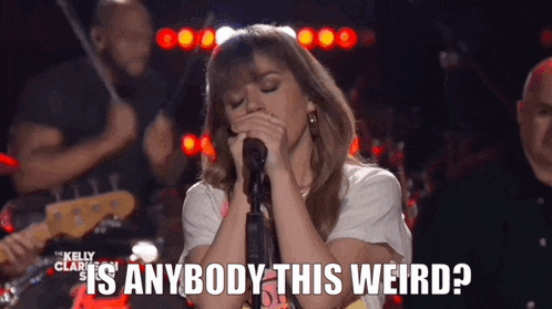 a woman singing into a microphone with the words " is anybody this weird " above her