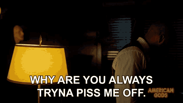 a man stands in front of a lamp and says why are you always tryna piss me off american gods