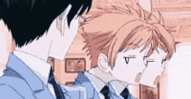 two anime characters in suits and ties are standing next to each other .