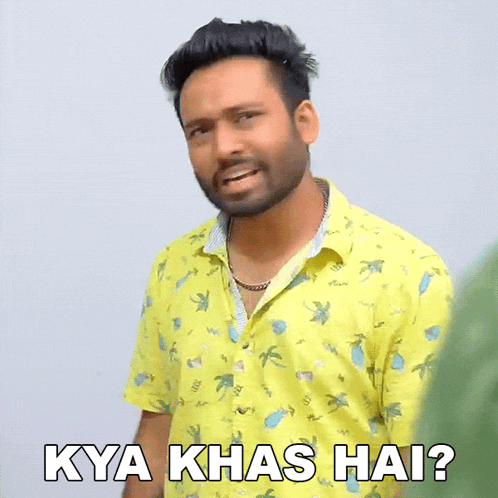 a man in a yellow shirt is making a funny face and says kya khas hai