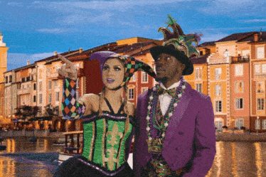 a man and a woman dressed in mardi gras costumes
