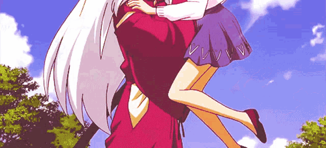 a girl in a skirt with hearts on it is being carried by a man in a red shirt
