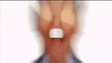 a close up of a man 's face with his mouth open and his eyes closed