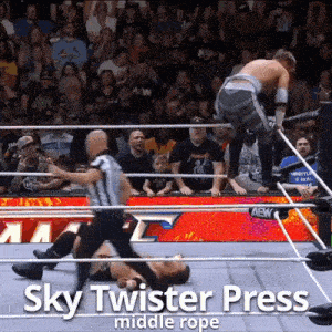 a wrestling match with the words sky twister press middle rope