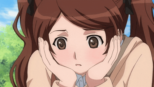 a girl with pigtails has her hands on her face
