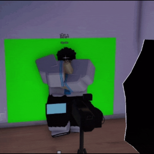 a video game character is laying on the floor with a green screen behind him