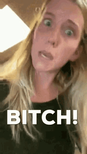 a woman is making a funny face with the words bitch written on her face .