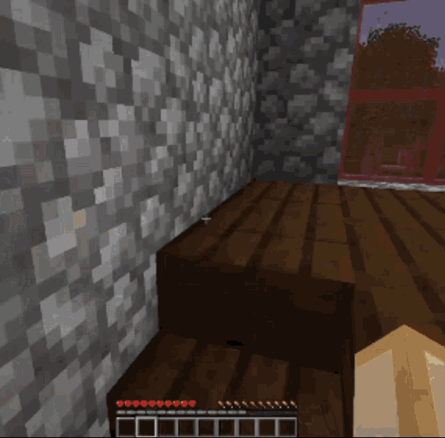 a screenshot of a video game shows a wooden floor and a wall