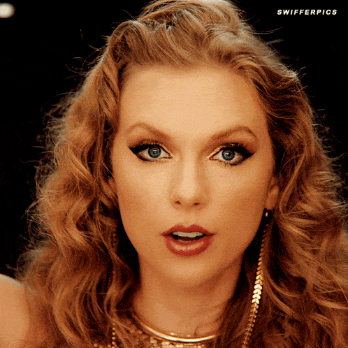 a close up of a woman 's face with the words swifter pics visible