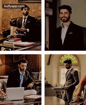a man in a suit and tie is sitting at a table with a laptop