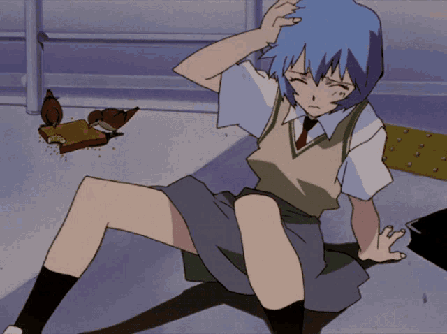 a girl in a school uniform is sitting on the ground