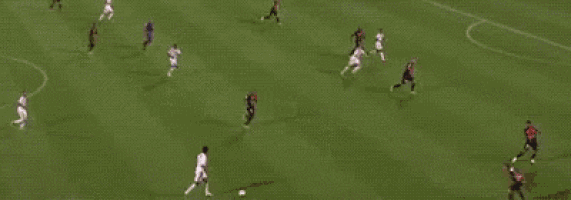 a soccer game is being played in front of hyundai and quick advertisements