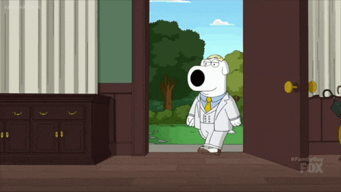a cartoon character in a white suit and tie stands in an open doorway with the fox logo on the bottom right