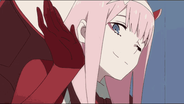 a girl with pink hair and blue eyes has a red glove on
