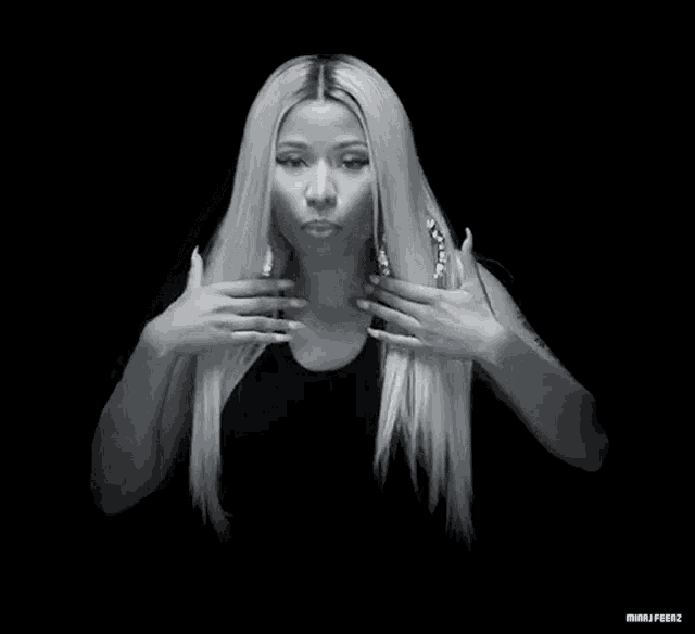 a black and white photo of a woman with blonde hair
