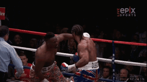 two men in a boxing ring with a sign that says epix sports