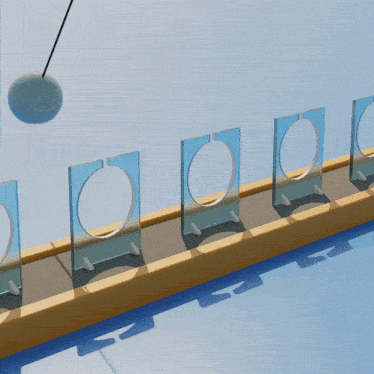 a blue ball is hanging from a string between two circles