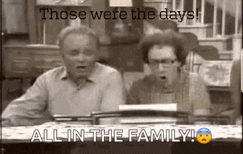 two people are sitting at a table with their mouths open and the words `` those were the days ! ''