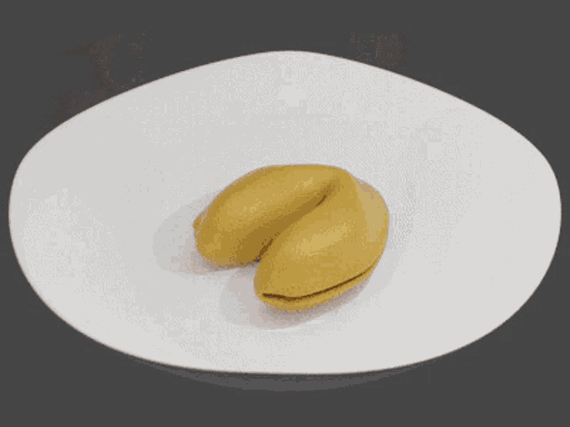a yellow fortune cookie with a picture of a woman coming out of it