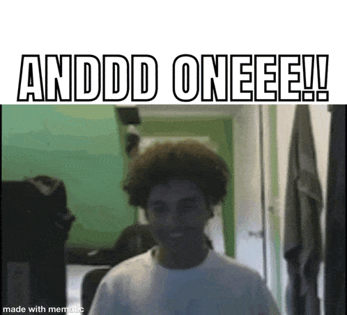 a man with curly hair is standing in a room with the words andddd oneeee !