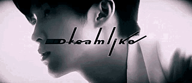 a black and white photo of a man 's face with the words dreamlike written above him .