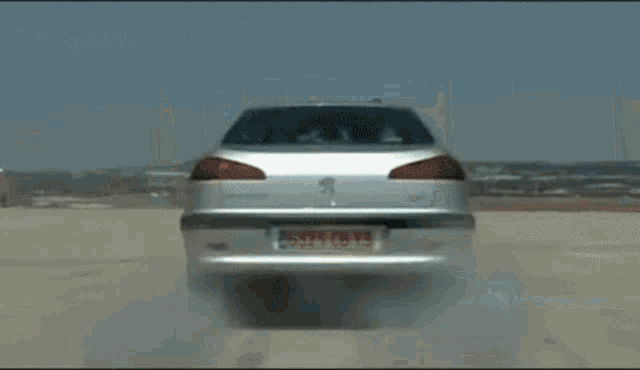 a silver car with a license plate that says j6921cb73