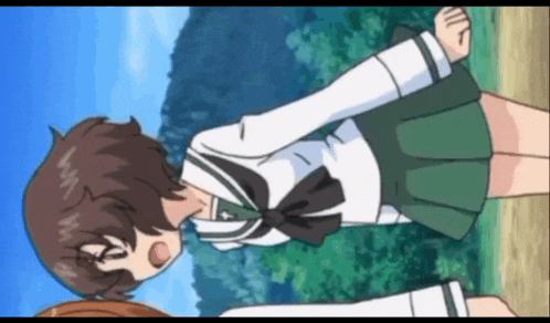 a girl in a white shirt and green skirt is laying down