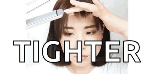 a woman is using a hair straightener to straighten her hair and the word tighter is above her head .
