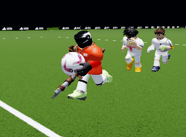 a soccer player is holding a soccer ball in his hand