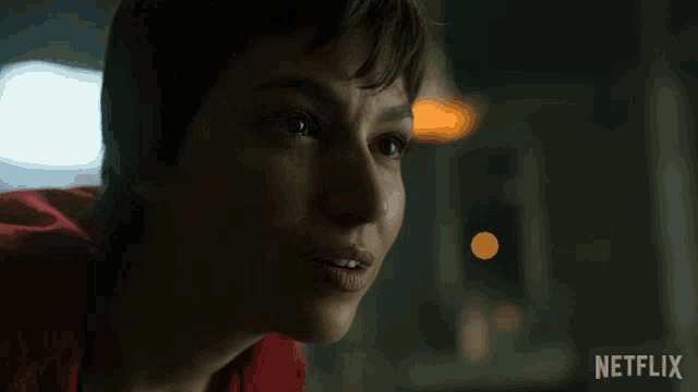 a close up of a woman 's face with netflix written on the bottom