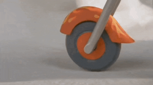 a close up of a toy motorcycle 's front wheel and fender .