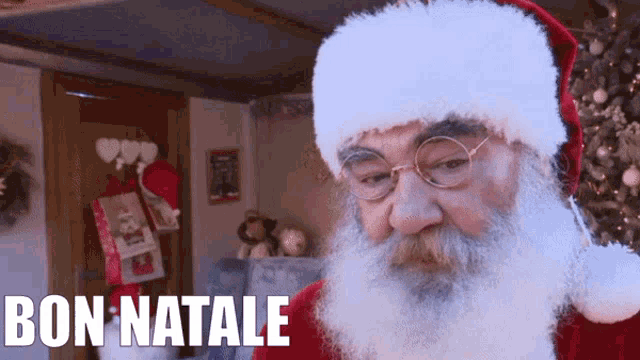 a picture of santa claus with the words bon natale written below him