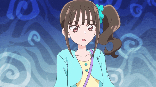 a girl with a ponytail is wearing a blue cardigan