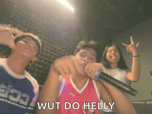 a man singing into a microphone with the words wut do helly on the bottom