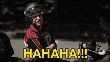 a man wearing a helmet is laughing while sitting on a motorcycle with the words " hahaha !!! " on the bottom