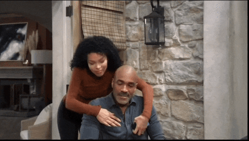 a woman is giving a man a massage on his back