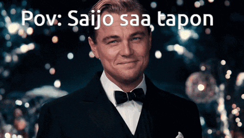 a man in a tuxedo and bow tie is smiling with the words pov saijo saa tapon above him