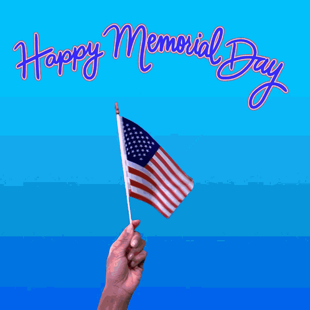 a hand holding a small american flag with the words happy memorial day written above it