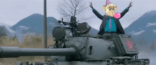 a man in a suit and tie is sitting on top of a tank