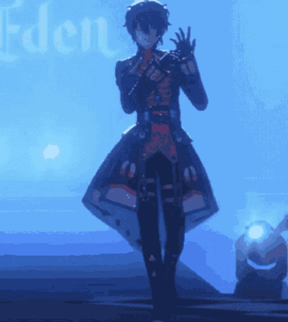 a man stands in front of a sign that says eden on it