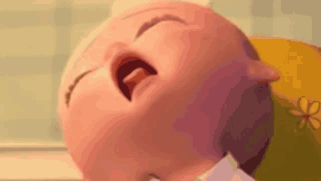 a close up of a cartoon baby crying with its mouth open .