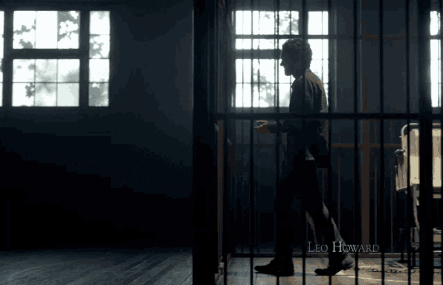 a man in a prison cell with the name leo howard on the bottom